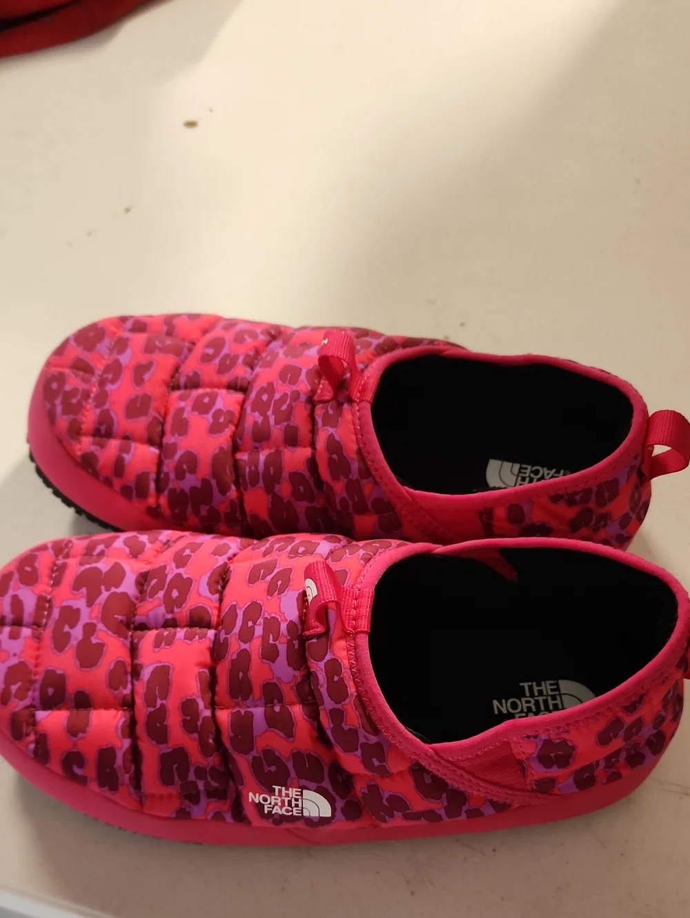 The North Face Kids Pink Leopard Slip-On Puffer Shoes